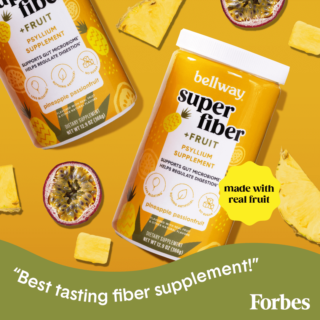 Bellway Super Fiber + Fruit pineapple passionfruit tubs on a yellow surface with pineapple and passionfruit slices. Forbes Magazine quote says "Best tasting fiber supplement!"