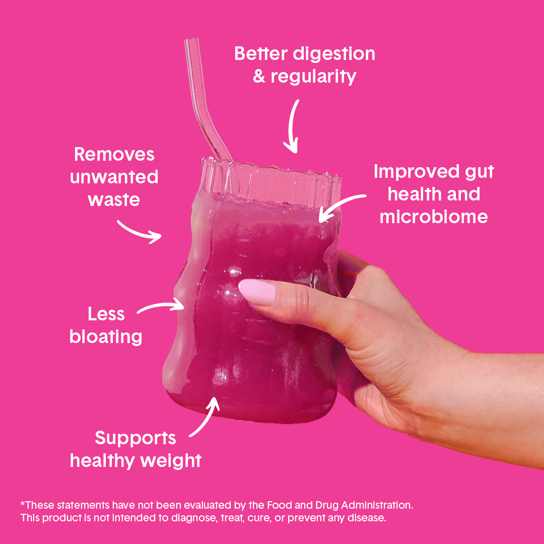 Hand holding Bellway Super Fiber supplement drink in a clear glass on a magenta background with surrounding text that reads: "Supports healthy weight, less bloating, removes unwanted waste, better digestion & regularity, improved gut health and microbiome."