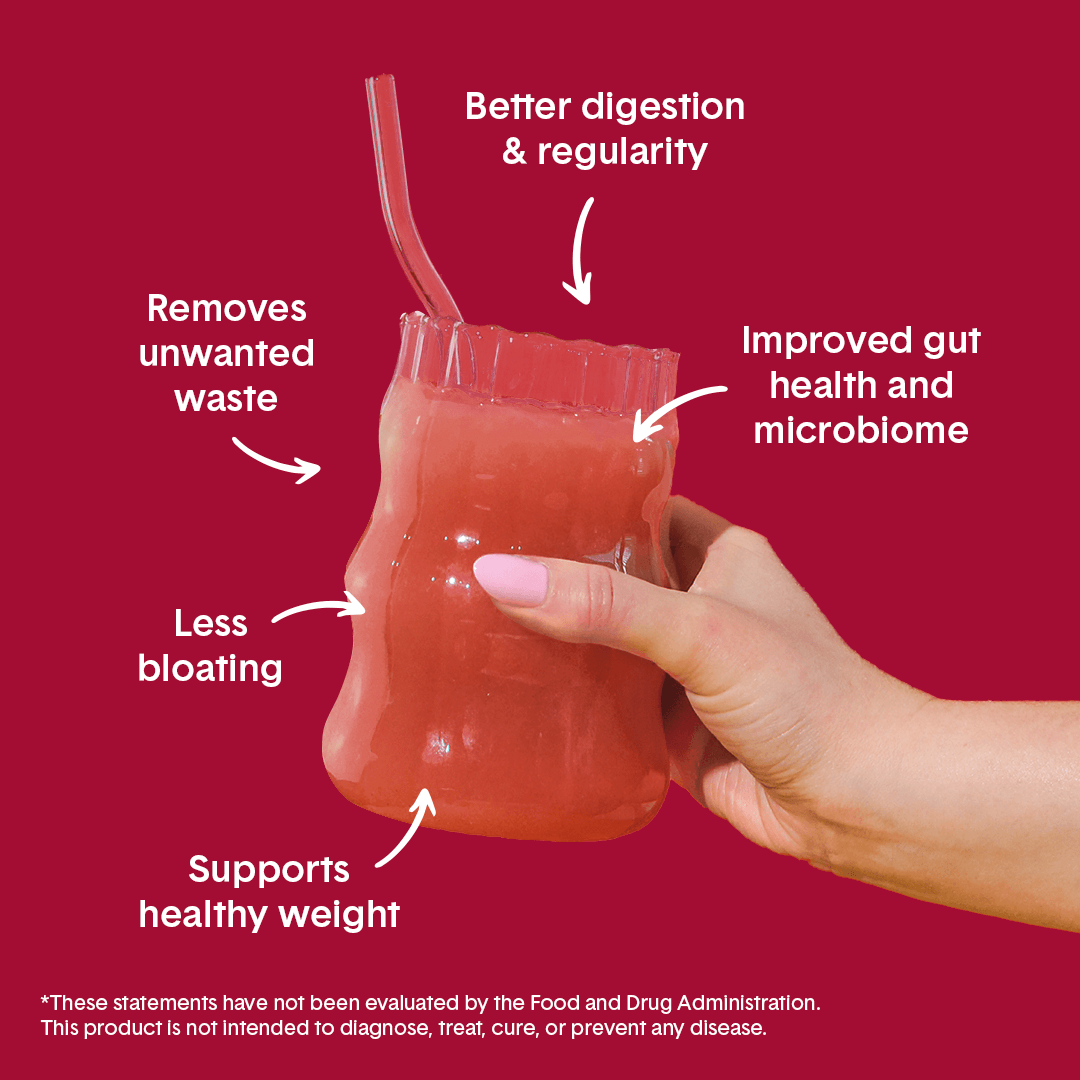 Hand holding Bellway Super Fiber supplement drink in a clear glass on a red background with surrounding text that reads: "Supports healthy weight, less bloating, removes unwanted waste, better digestion & regularity, improved gut health and microbiome."