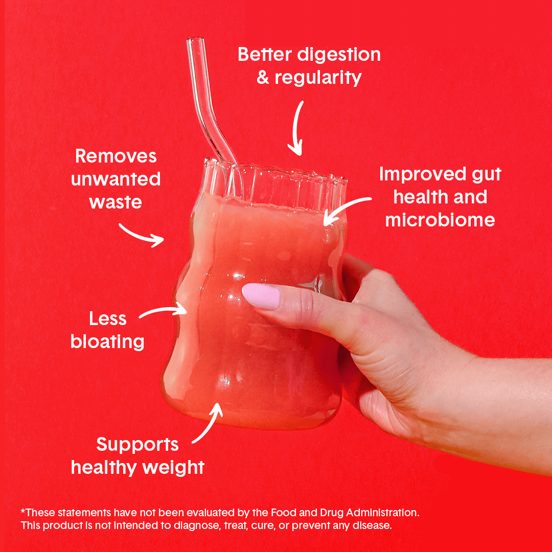 Hand holding Bellway Super Fiber supplement drink in a clear glass on a red background with surrounding text that reads: "Supports healthy weight, less bloating, removes unwanted waste, better digestion & regularity, improved gut health and microbiome."