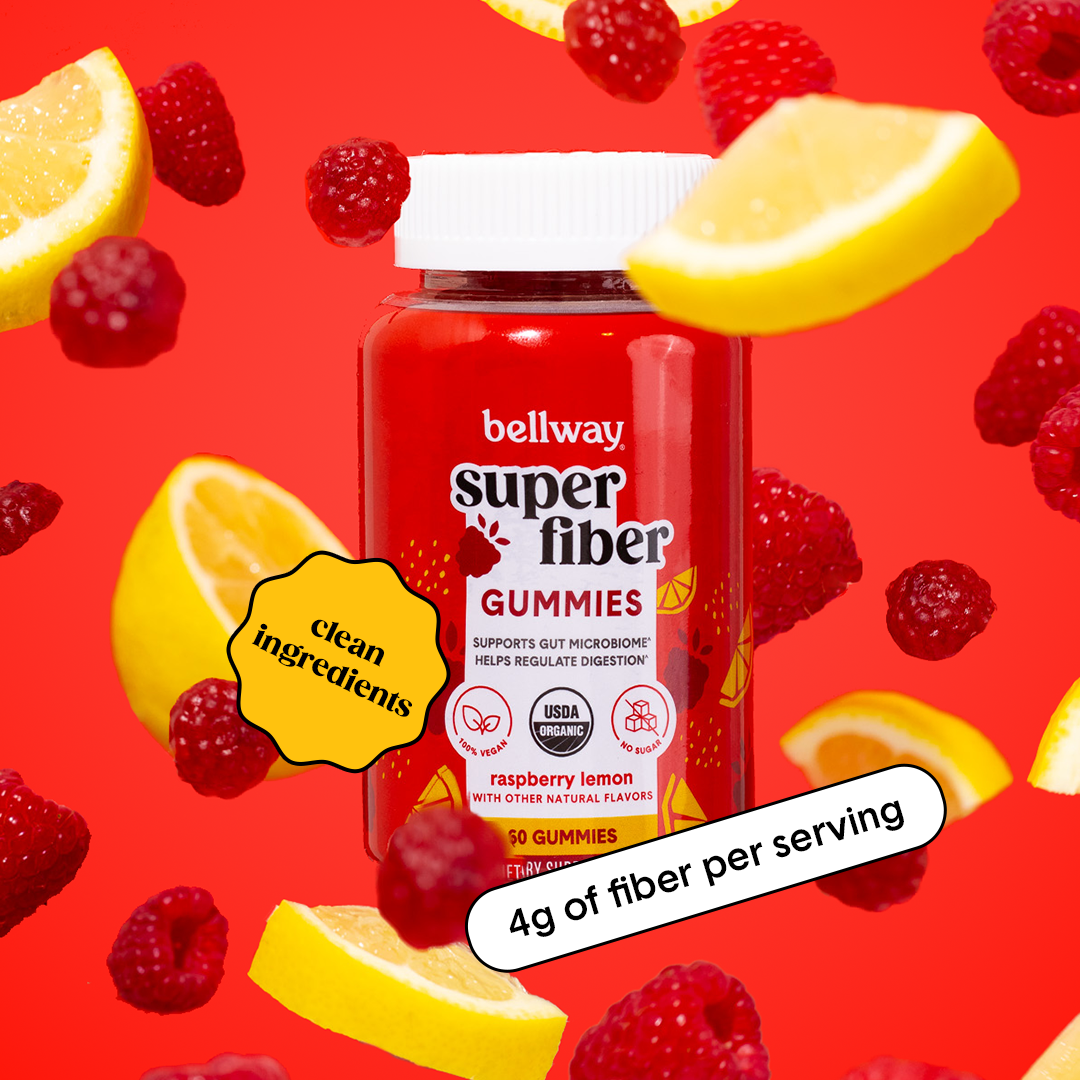 Bellway Super Fiber raspberry lemon gummies product floating on a red background with floating raspberries, gummies, and lemon slices. Text callouts read "clean ingredients" and "4g of fiber per serving."